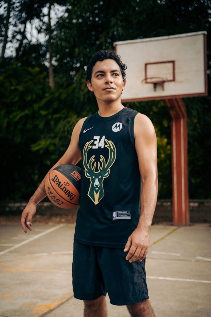 Portrait of a young man holding a basketball outdoors in Rioja, San Martín, Perú.